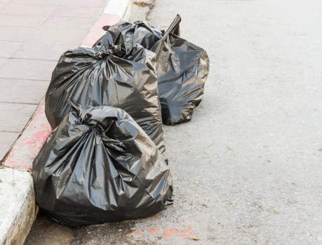 People disposing of furniture at a recycling center in Victoria